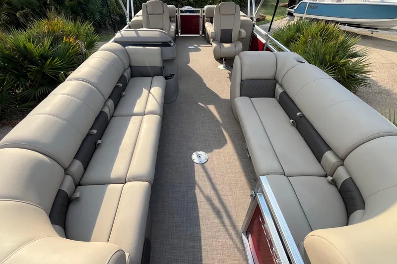 Slide: The Image of 2024 Sun Tracker Party Barge 24 DLX interior with spacious seating and modern design. - 4