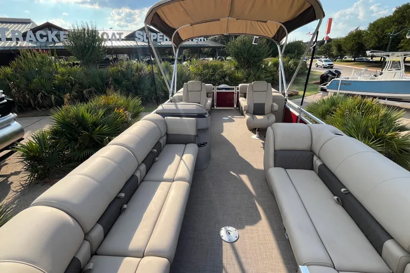 Slide: The Image of 2024 Sun Tracker Party Barge 24 DLX pontoon boat with spacious seating and canopy. - 5