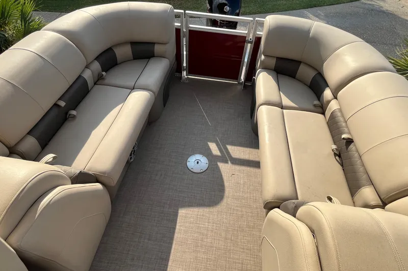 Slide: The Image of 2024 Sun Tracker Party Barge 24 DLX interior with spacious seating and modern design. - 8