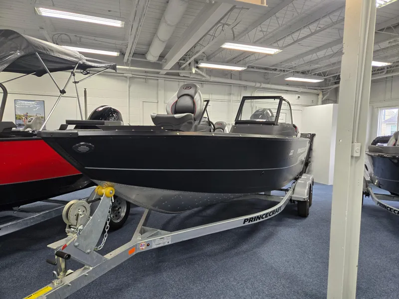 The Image of 2024 Princecraft Xpedition 200 boat on trailer in showroom setting. - 0