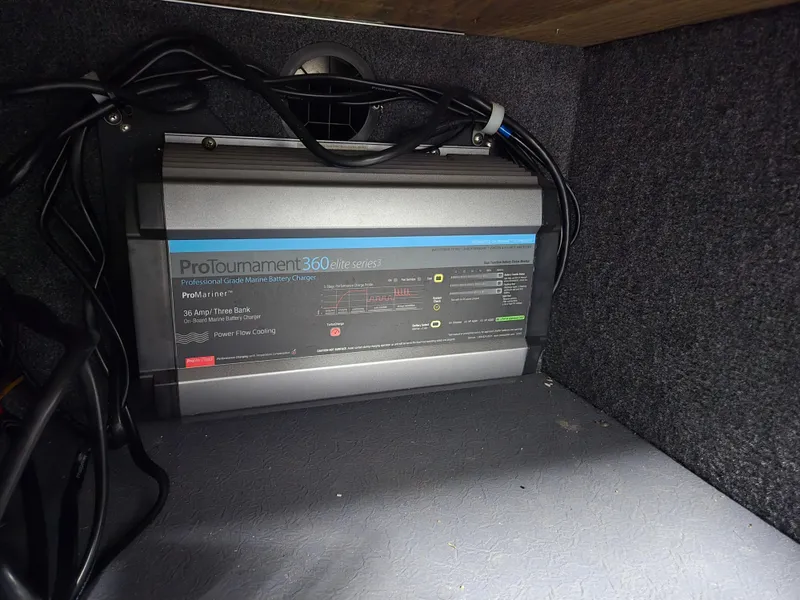Slide: The Image of Battery charger inside 2024 Princecraft Xpedition 200 boat, featuring ProTournament 360 system. - 14