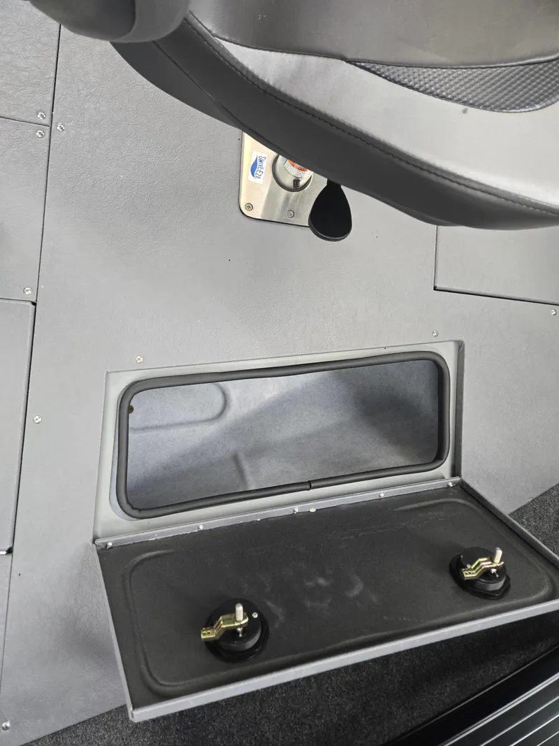 Slide: The Image of 2024 Princecraft Xpedition 200 boat interior storage compartment with secure latches. - 17