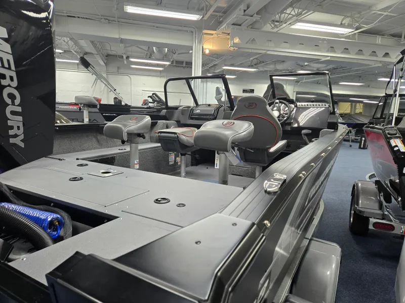 Slide: The Image of 2024 Princecraft Xpedition 200 boat interior with seating and controls in showroom. - 4