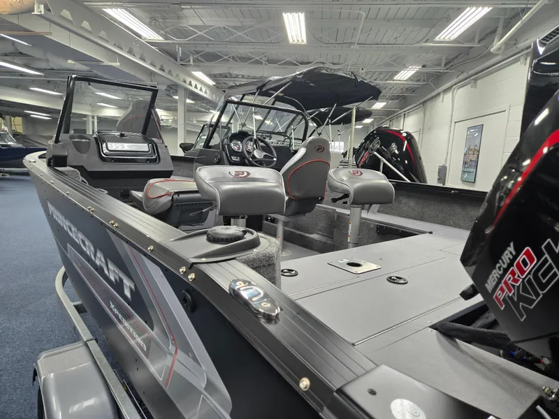 Slide: The Image of 2024 Princecraft Xpedition 200 boat interior with seating and Mercury Pro Kick motor. - 6