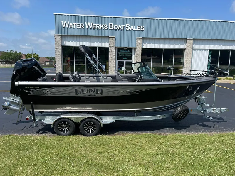 Slide: The Image of 2025 Lund 2275 Baron boat on trailer at Water Werks Boat Sales. - 0