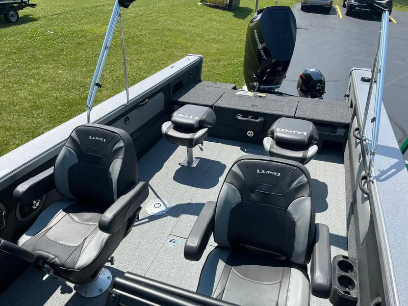 Slide: The Image of Interior of 2025 Lund 2275 Baron boat with seating and motor. - 13