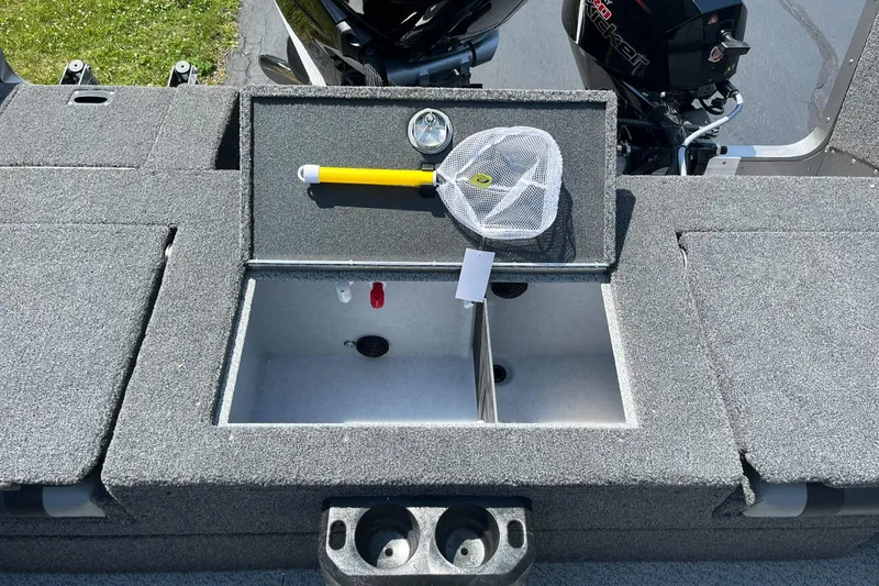 Slide: The Image of 2025 Lund 2275 Baron boat livewell with fishing net and cup holders. - 16