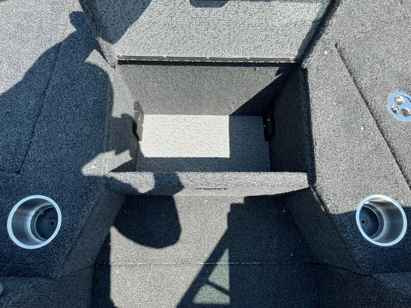 Slide: The Image of Interior of 2025 Lund 2275 Baron boat with carpeted storage compartments. - 31