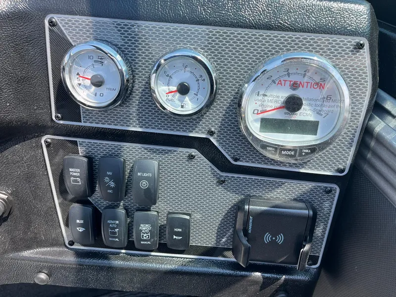 Slide: The Image of Dashboard of 2025 Lund 2275 Baron boat with gauges and control switches. - 34