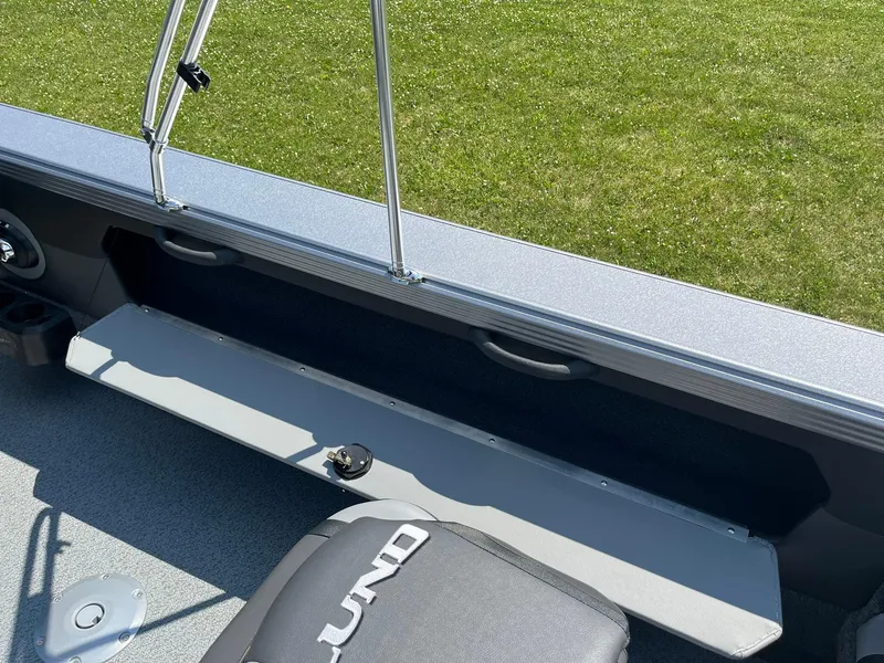 Slide: The Image of 2025 Lund 2275 Baron boat interior with seating and storage. - 39