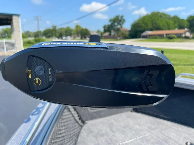 Slide: The Image of Close-up of a 2025 Lund 2275 Baron boat component under a clear blue sky. - 40