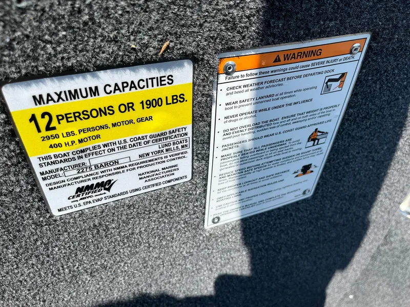 Slide: The Image of Warning and capacity labels on 2025 Lund 2275 Baron boat. - 44