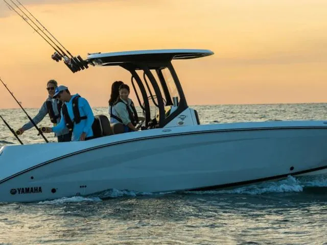 Slide: The Image of 2024 Yamaha Boats 255 FSH Sport H on the water at sunset. - 8