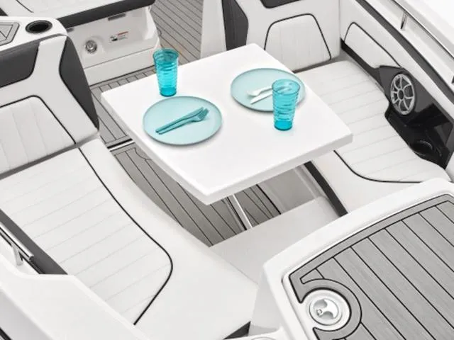 Slide: The Image of Yamaha Boats 2024 255 FSH Sport E interior with dining table setup. - 3