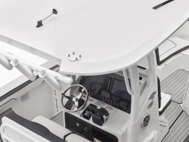 Slide: The Image of 2024 Yamaha Boats 255 FSH Sport E helm station with steering wheel and controls. - 6