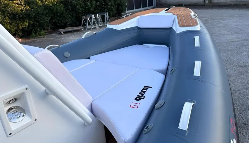 Slide: The Image of 2025 Aqvaboats luxrib 19 inflatable boat with cushioned seating and sleek design. - 23