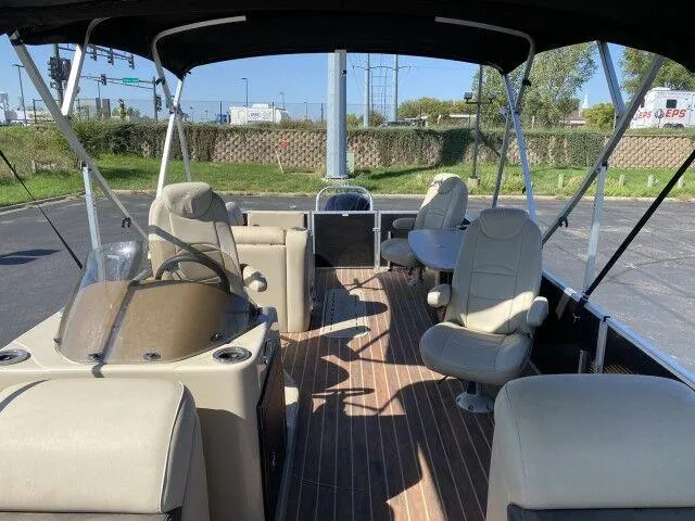 Slide: The Image of 2015 Silver Wave 250 Island SB Tri-Toon boat interior with seating and steering console. - 7