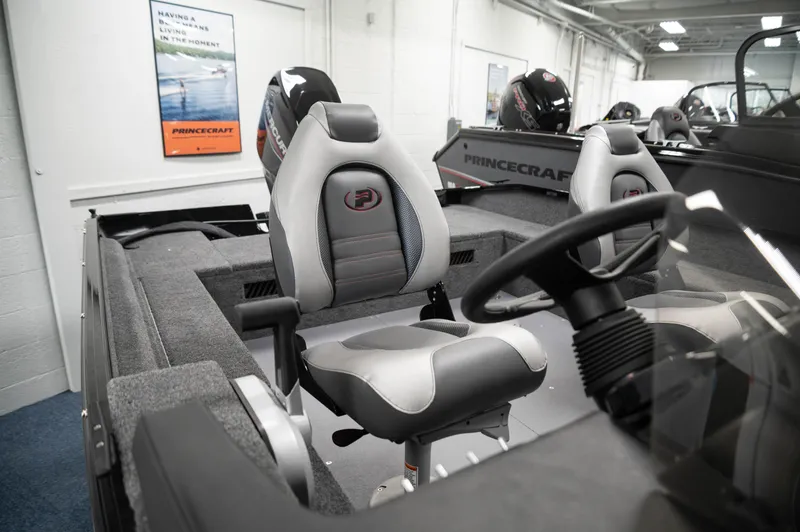 Slide: The Image of 2024 Princecraft Holiday 162 SC MAX boat interior with steering wheel and seating. - 10