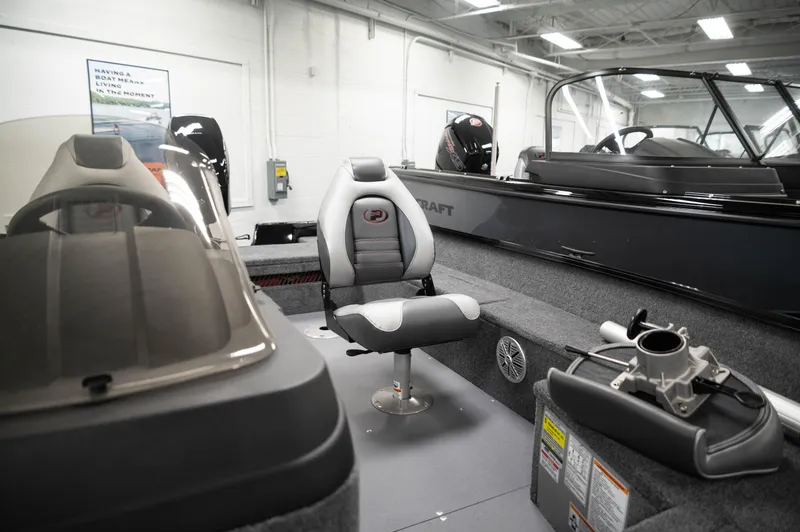 Slide: The Image of 2024 Princecraft Holiday 162 SC MAX boat interior with seating and console. - 11