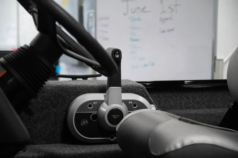 Slide: The Image of Close-up of the 2024 Princecraft Holiday 162 SC MAX boat's steering console. - 12
