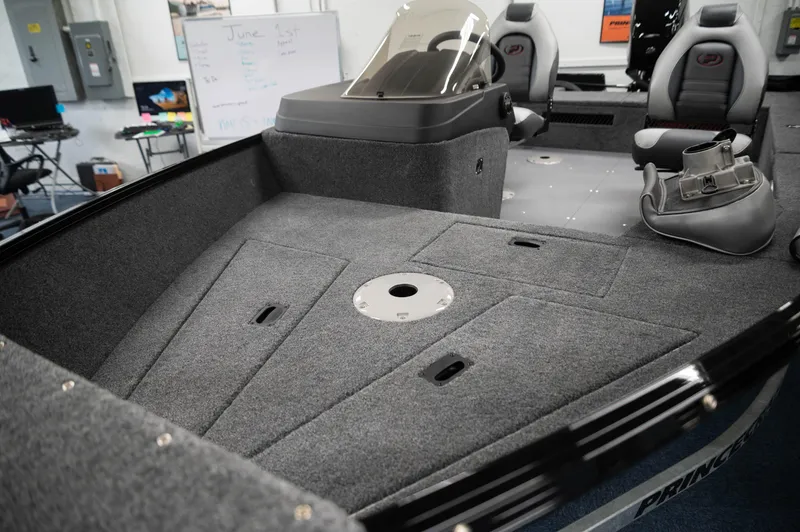 Slide: The Image of 2024 Princecraft Holiday 162 SC MAX boat interior with seating and storage compartments. - 2