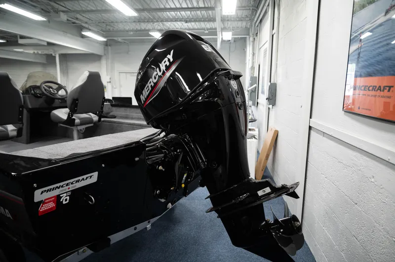 Slide: The Image of 2024 Princecraft Holiday 162 SC MAX with Mercury outboard motor in showroom. - 3