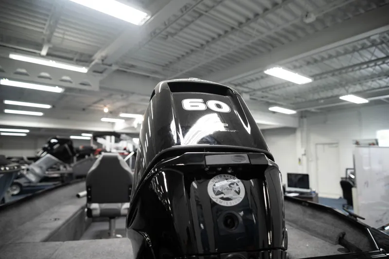 Slide: The Image of 2024 Princecraft Holiday 162 SC MAX boat with 60 HP engine in showroom. - 4