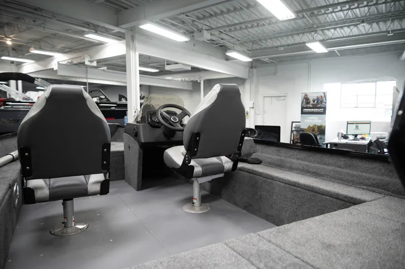 Slide: The Image of 2024 Princecraft Holiday 162 SC MAX boat interior with dual seats and steering console. - 6