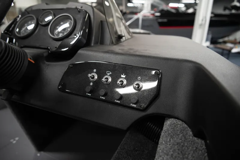 Slide: The Image of 2024 Princecraft Holiday 162 SC MAX boat dashboard with control switches and gauges. - 8