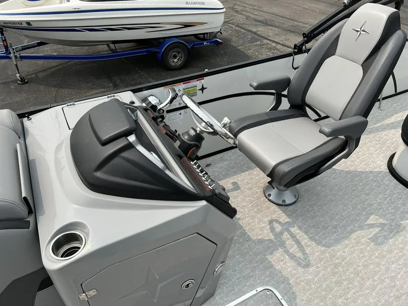 Slide: The Image of 2021 Berkshire 23 SB2 STS boat cockpit with captain's chair and control panel. - 5
