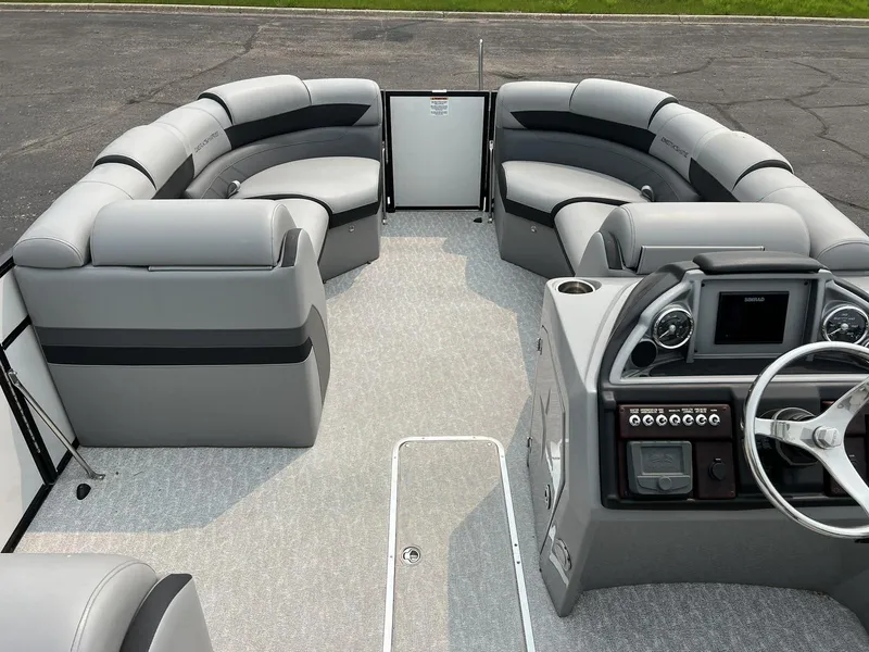 Slide: The Image of 2021 Berkshire 23 SB2 STS pontoon boat interior with gray seating and modern dashboard. - 9