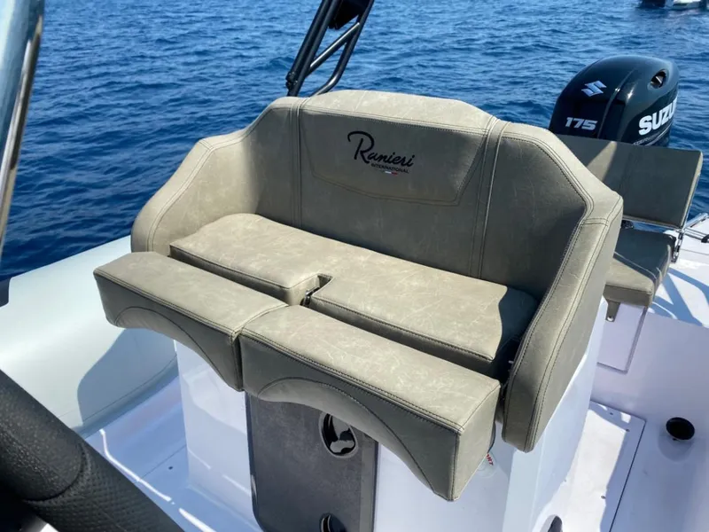 Slide: The Image of 2025 Ranieri CAYMAN 23 Sport boat seat with Suzuki 175 outboard motor. - 11