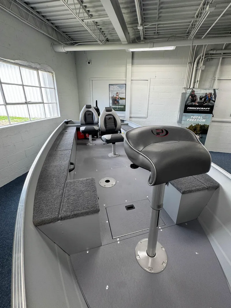 Slide: The Image of 2024 Princecraft Resorter 160 BT boat interior with seating and storage. - 14