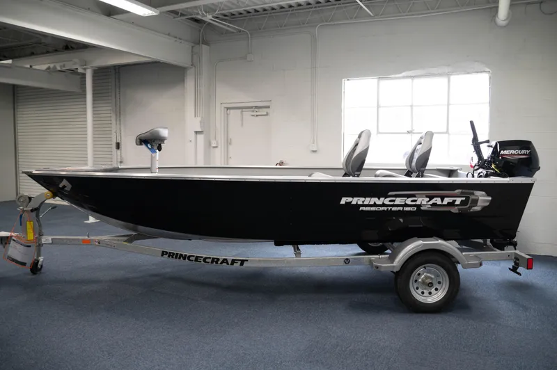 Slide: The Image of 2024 Princecraft Resorter 160 BT fishing boat on trailer in indoor showroom. - 2