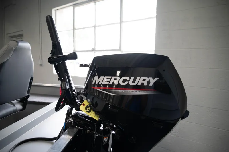 Slide: The Image of 2024 Princecraft Resorter 160 BT with Mercury outboard motor in a showroom. - 4