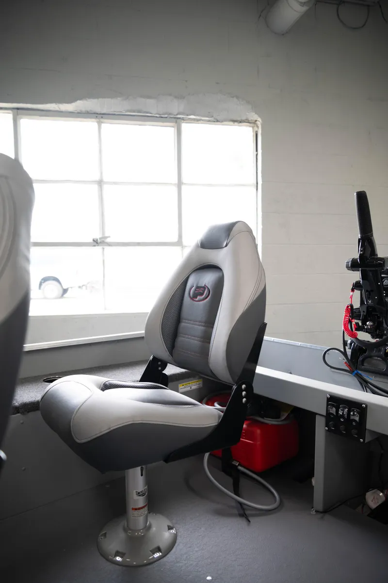 Slide: The Image of 2024 Princecraft Resorter 160 BT boat interior with captain's chair. - 5