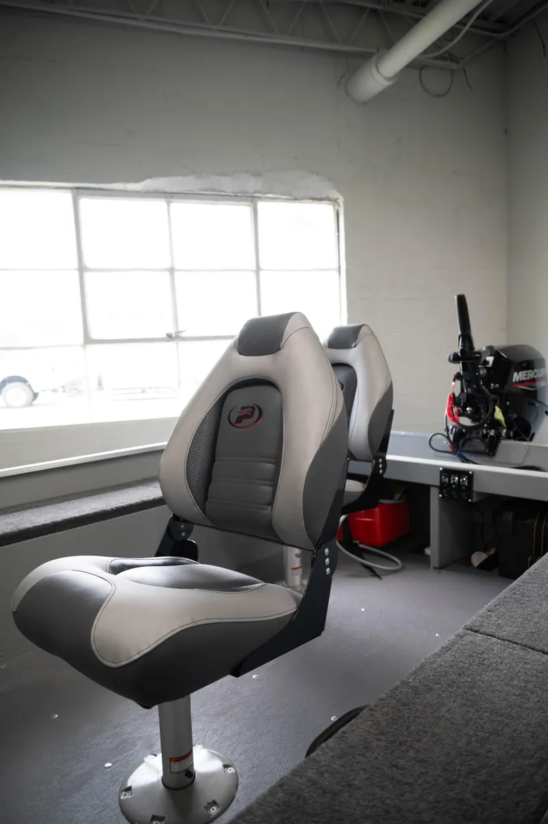 Slide: The Image of 2024 Princecraft Resorter 160 BT boat interior with comfortable seating and modern design. - 6