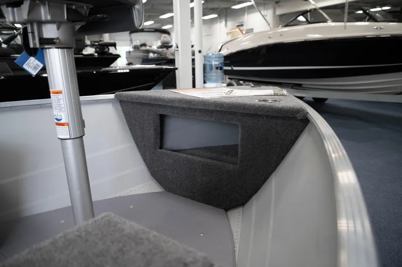 Slide: The Image of 2024 Princecraft Resorter 160 BT interior detail at a boat showroom. - 9
