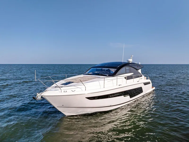 Slide: The Image of 2025 Fairline Targa 50 GT luxury yacht cruising on open water. - 10
