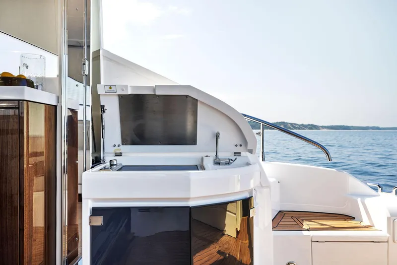 Slide: The Image of Fairline Targa 50 GT 2025 yacht deck with sleek design and ocean view. - 16