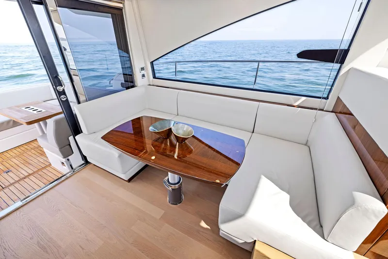 Slide: The Image of Luxurious interior of 2025 Fairline Targa 50 GT yacht with ocean view. - 20