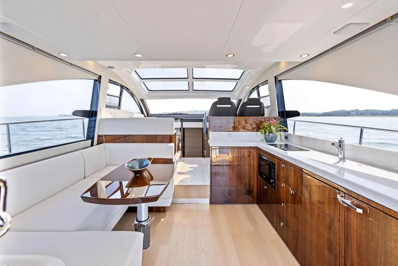 Slide: The Image of Luxurious interior of 2025 Fairline Targa 50 GT yacht with modern kitchen and seating area. - 22