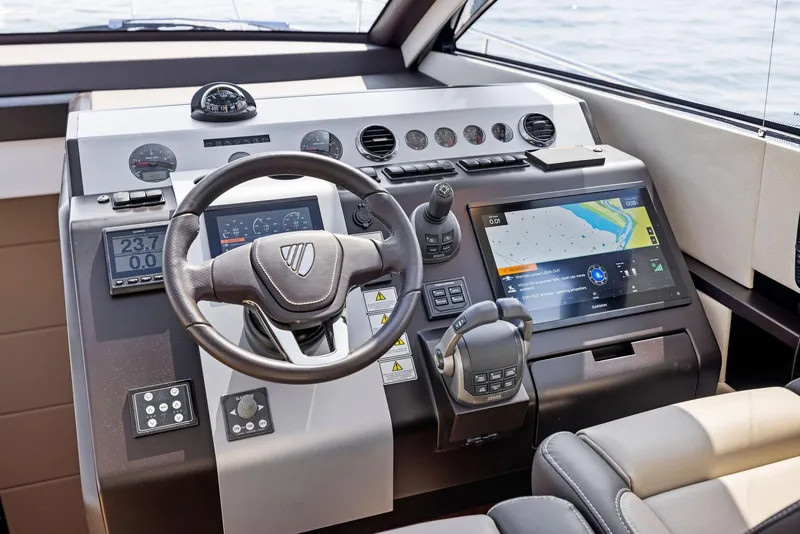 Slide: The Image of 2025 Fairline Targa 50 GT helm with advanced navigation and control systems. - 29