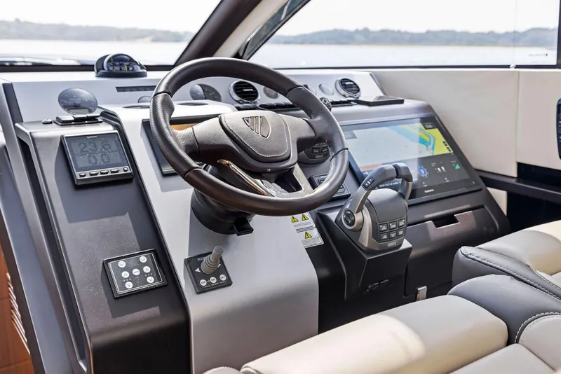 Slide: The Image of Helm of 2025 Fairline Targa 50 GT yacht with advanced navigation controls and touchscreen display. - 30