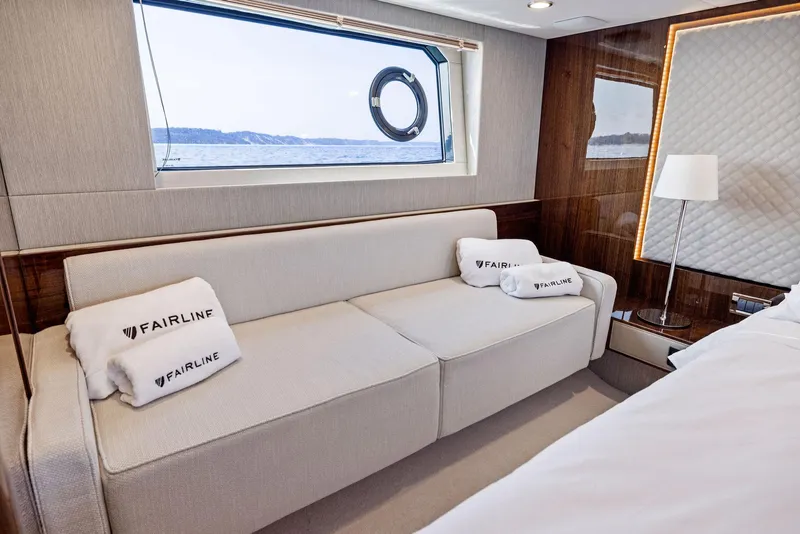 Slide: The Image of Luxurious interior of 2025 Fairline Targa 50 GT yacht with elegant sofa and sea view. - 33