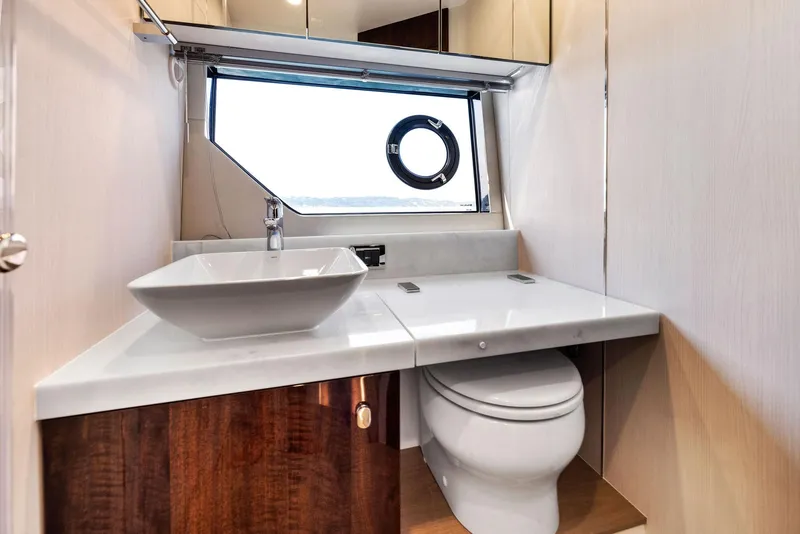 Slide: The Image of Luxurious bathroom in 2025 Fairline Targa 50 GT yacht with modern sink and porthole window. - 37