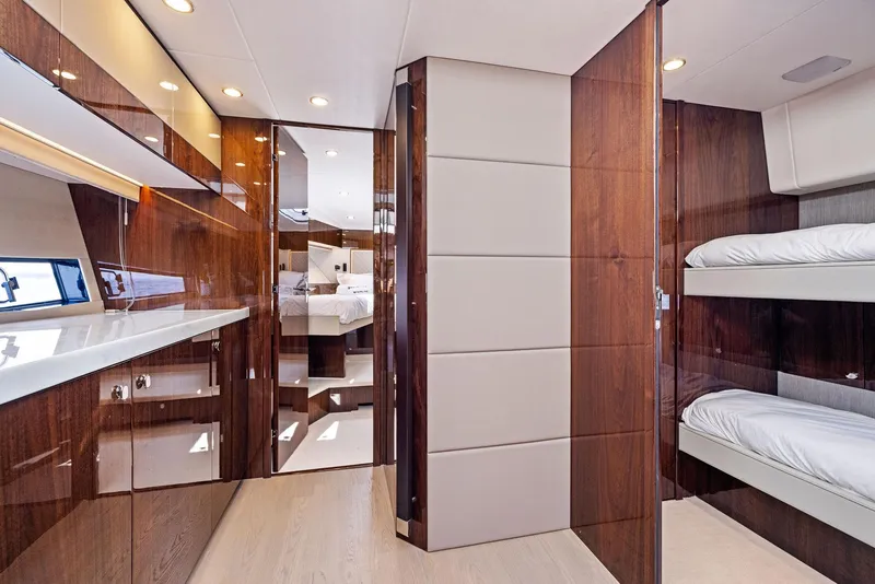 Slide: The Image of Luxurious interior of 2025 Fairline Targa 50 GT yacht with wood paneling and bunk beds. - 41