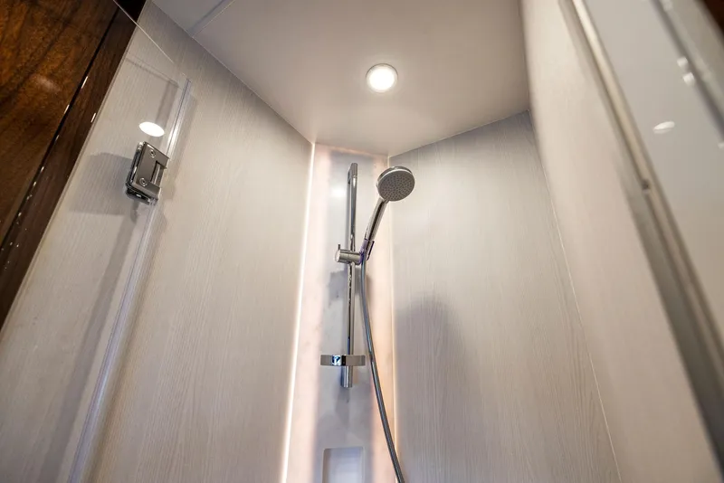 Slide: The Image of Modern shower in 2025 Fairline Targa 50 GT yacht, featuring sleek design and chrome fixtures. - 44