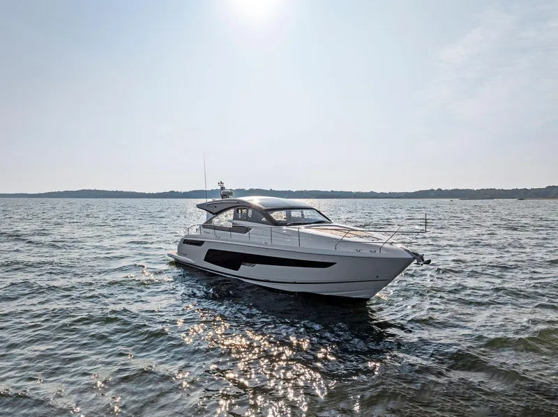 Slide: The Image of 2025 Fairline Targa 50 GT yacht cruising on open water under a clear sky. - 8