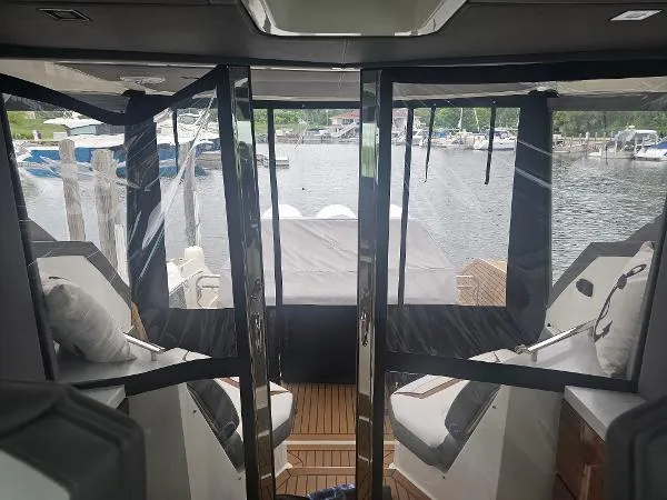 Slide: The Image of Interior view of 2021 Tiara Sport 43 LE yacht docked at marina. - 14